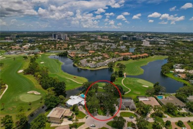 Step into timeless elegance in this stunning Colonial-style on Feather Sound Country Club in Florida - for sale on GolfHomes.com, golf home, golf lot