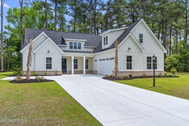 This new construction split bedroom home with 4 bedrooms, 3.5 on Brunswick Plantation and Golf Resorts in North Carolina - for sale on GolfHomes.com, golf home, golf lot