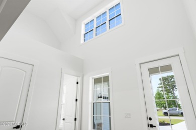 This new construction split bedroom home with 4 bedrooms, 3.5 on Brunswick Plantation and Golf Resorts in North Carolina - for sale on GolfHomes.com, golf home, golf lot