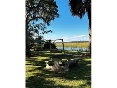 This .61 acre lot in gated Coopers Point is located on a private on Sapelo Hammock Golf Club in Georgia - for sale on GolfHomes.com, golf home, golf lot