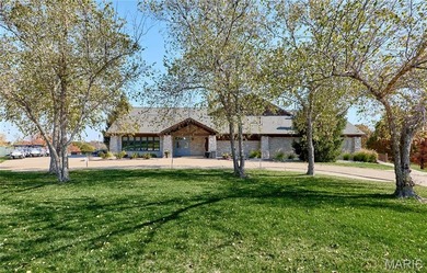 Poised on a premium lot backing to the 5th green of Bear Creek on Bear Creek Golf Club in Missouri - for sale on GolfHomes.com, golf home, golf lot