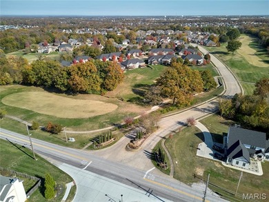 Poised on a premium lot backing to the 5th green of Bear Creek on Bear Creek Golf Club in Missouri - for sale on GolfHomes.com, golf home, golf lot