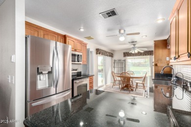Welcome to your playful paradise! This 3-bedroom charmer with a on Arizona Golf Resort and Conference Center in Arizona - for sale on GolfHomes.com, golf home, golf lot