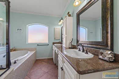 Enjoy lake views and fairway living at 13 Hacienda Dr. This on South Padre Island Golf Club in Texas - for sale on GolfHomes.com, golf home, golf lot