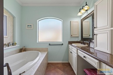 Enjoy lake views and fairway living at 13 Hacienda Dr. This on South Padre Island Golf Club in Texas - for sale on GolfHomes.com, golf home, golf lot