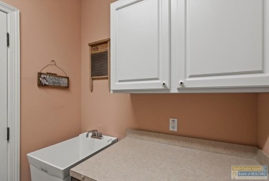 Enjoy lake views and fairway living at 13 Hacienda Dr. This on South Padre Island Golf Club in Texas - for sale on GolfHomes.com, golf home, golf lot