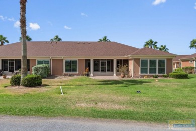 Enjoy lake views and fairway living at 13 Hacienda Dr. This on South Padre Island Golf Club in Texas - for sale on GolfHomes.com, golf home, golf lot