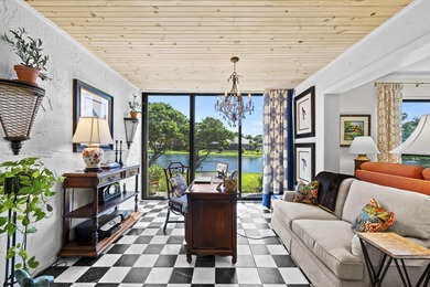 Spacious lakefront golf villa with 3 bedrooms, 2.5 bathrooms on Mariner Sands Country Club in Florida - for sale on GolfHomes.com, golf home, golf lot