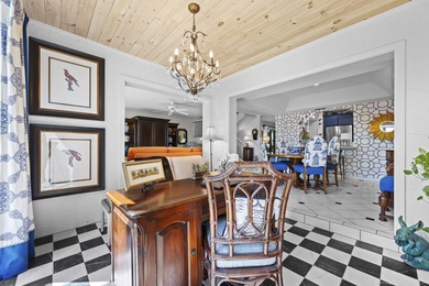 Spacious lakefront golf villa with 3 bedrooms, 2.5 bathrooms on Mariner Sands Country Club in Florida - for sale on GolfHomes.com, golf home, golf lot