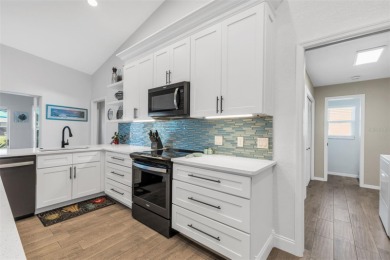 Welcome to this beautifully updated and fully turnkey 3-bedroom on Pinemoor West Golf Club in Florida - for sale on GolfHomes.com, golf home, golf lot