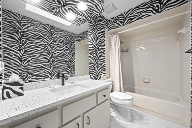 Spacious lakefront golf villa with 3 bedrooms, 2.5 bathrooms on Mariner Sands Country Club in Florida - for sale on GolfHomes.com, golf home, golf lot