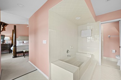 Spacious lakefront golf villa with 3 bedrooms, 2.5 bathrooms on Mariner Sands Country Club in Florida - for sale on GolfHomes.com, golf home, golf lot