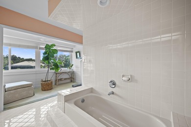 Spacious lakefront golf villa with 3 bedrooms, 2.5 bathrooms on Mariner Sands Country Club in Florida - for sale on GolfHomes.com, golf home, golf lot