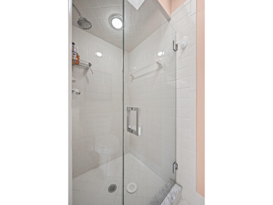 Spacious lakefront golf villa with 3 bedrooms, 2.5 bathrooms on Mariner Sands Country Club in Florida - for sale on GolfHomes.com, golf home, golf lot