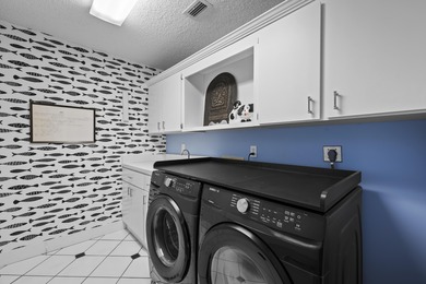 Spacious lakefront golf villa with 3 bedrooms, 2.5 bathrooms on Mariner Sands Country Club in Florida - for sale on GolfHomes.com, golf home, golf lot