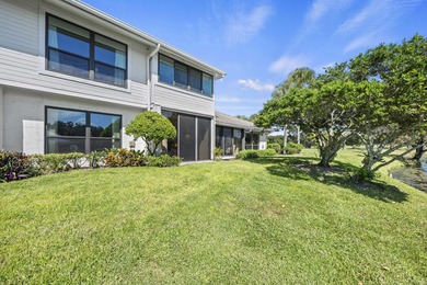 Spacious lakefront golf villa with 3 bedrooms, 2.5 bathrooms on Mariner Sands Country Club in Florida - for sale on GolfHomes.com, golf home, golf lot