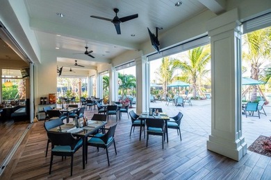 Spacious lakefront golf villa with 3 bedrooms, 2.5 bathrooms on Mariner Sands Country Club in Florida - for sale on GolfHomes.com, golf home, golf lot