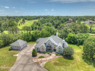 Welcome home to 2401 Sandstone Way! Located in desired Loma on The Bald Eagle Course At Eagle Creek Golf Club in Missouri - for sale on GolfHomes.com, golf home, golf lot