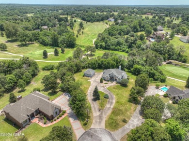 Welcome home to 2401 Sandstone Way! Located in desired Loma on The Bald Eagle Course At Eagle Creek Golf Club in Missouri - for sale on GolfHomes.com, golf home, golf lot