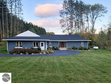 Positioned on corner parcel, this home blends comfort & casual on  in Michigan - for sale on GolfHomes.com, golf home, golf lot