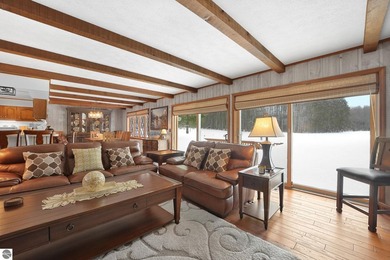 Positioned on corner parcel, this home blends comfort & casual on  in Michigan - for sale on GolfHomes.com, golf home, golf lot