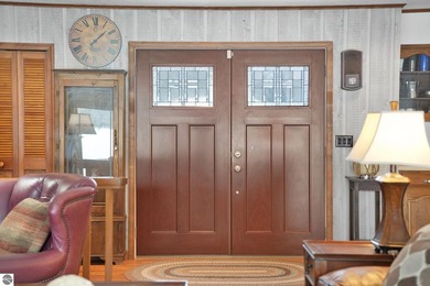 Positioned on corner parcel, this home blends comfort & casual on  in Michigan - for sale on GolfHomes.com, golf home, golf lot