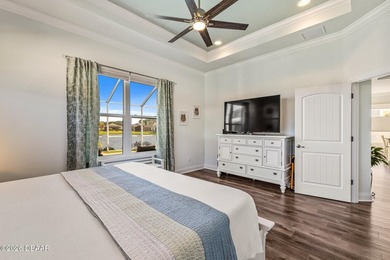 Step into a world of thoughtful beauty in this custom waterfront on Venetian Bay Golf Course in Florida - for sale on GolfHomes.com, golf home, golf lot