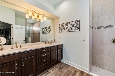 Step into a world of thoughtful beauty in this custom waterfront on Venetian Bay Golf Course in Florida - for sale on GolfHomes.com, golf home, golf lot