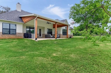 Thisnmodern-farmhouse style home is ideally located on a quiet on Lake Kiowa Golf Course in Texas - for sale on GolfHomes.com, golf home, golf lot