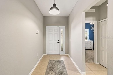 Under contract-accepting backup offers. Welcome home to this on Royal St. Cloud Golf Links in Florida - for sale on GolfHomes.com, golf home, golf lot