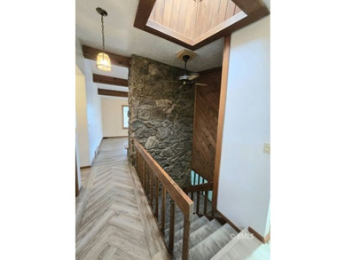 This large, contemporary family residence boasts five bedrooms on Miles City Town and Country Club in Montana - for sale on GolfHomes.com, golf home, golf lot