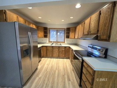 This large, contemporary family residence boasts five bedrooms on Miles City Town and Country Club in Montana - for sale on GolfHomes.com, golf home, golf lot