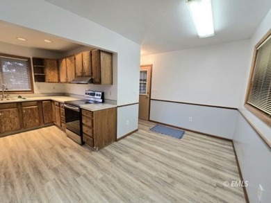 This large, contemporary family residence boasts five bedrooms on Miles City Town and Country Club in Montana - for sale on GolfHomes.com, golf home, golf lot