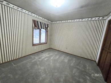 This large, contemporary family residence boasts five bedrooms on Miles City Town and Country Club in Montana - for sale on GolfHomes.com, golf home, golf lot