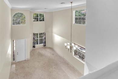 Elegant two-story residence located in the highly sought-after on Palm-Aire Country Club and Resort - The Oaks in Florida - for sale on GolfHomes.com, golf home, golf lot