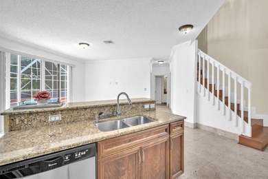 Elegant two-story residence located in the highly sought-after on Palm-Aire Country Club and Resort - The Oaks in Florida - for sale on GolfHomes.com, golf home, golf lot