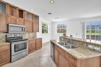 Elegant two-story residence located in the highly sought-after on Palm-Aire Country Club and Resort - The Oaks in Florida - for sale on GolfHomes.com, golf home, golf lot