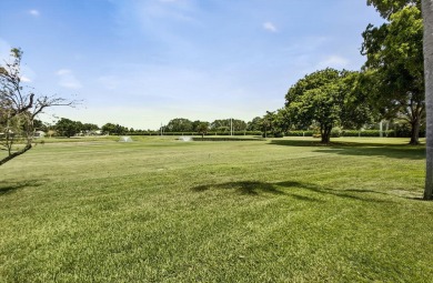 Rare opportunity to  purchase 1st floor, corner unit overlooking on Old Marsh Golf Club in Florida - for sale on GolfHomes.com, golf home, golf lot