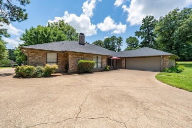 Absolutely stunning brick home in highly sought-after gated on Holly Lake Ranch Golf Club in Texas - for sale on GolfHomes.com, golf home, golf lot