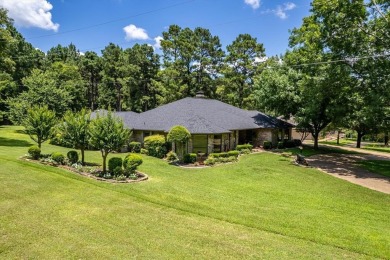 Absolutely stunning brick home in highly sought-after gated on Holly Lake Ranch Golf Club in Texas - for sale on GolfHomes.com, golf home, golf lot