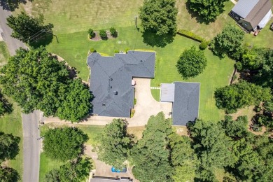 Absolutely stunning brick home in highly sought-after gated on Holly Lake Ranch Golf Club in Texas - for sale on GolfHomes.com, golf home, golf lot