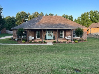 This stunning 4-bedroom, 2.5-bath home, nestled in a peaceful on Big Oaks Golf Club in Mississippi - for sale on GolfHomes.com, golf home, golf lot