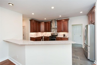 Discover this beautifully maintained home nestled in Eagle Watch on Canongate At Eagle Watch Golf Club in Georgia - for sale on GolfHomes.com, golf home, golf lot