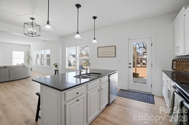 Beautifully updated and filled with natural light, this spacious on Tega Cay Golf Club in South Carolina - for sale on GolfHomes.com, golf home, golf lot