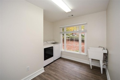 Discover this beautifully maintained home nestled in Eagle Watch on Canongate At Eagle Watch Golf Club in Georgia - for sale on GolfHomes.com, golf home, golf lot