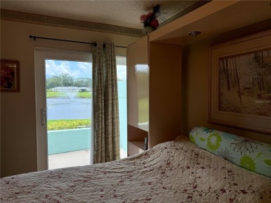Enjoy water views from every room!! Fully furnished 1BR/1.5BA on Highland Lakes Executive Golf Course in Florida - for sale on GolfHomes.com, golf home, golf lot