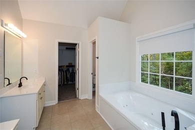 Discover this beautifully maintained home nestled in Eagle Watch on Canongate At Eagle Watch Golf Club in Georgia - for sale on GolfHomes.com, golf home, golf lot