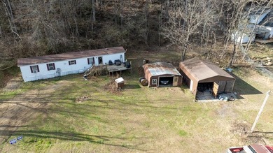 +9.7 unrestricted acres bordering Cherokee land and a on Smoky Mountain Country Club in North Carolina - for sale on GolfHomes.com, golf home, golf lot