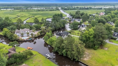 Discover the perfect blend of natural beauty and southern charm on Wedgefield Plantation Golf Club in South Carolina - for sale on GolfHomes.com, golf home, golf lot