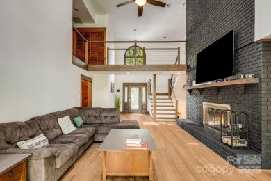 Welcome to this beautifully updated 4-bedroom, 4-bath home on Rumbling Bald Resort on Lake Lure in North Carolina - for sale on GolfHomes.com, golf home, golf lot